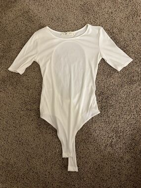 Grace White Ribbed Short Sleeve Bodysuit with Open Back
